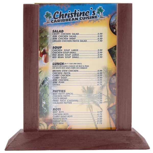 A Mahogany wood Menu Solutions table tent holding a menu on a table.