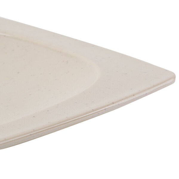 A matte sandstone oval platter with a hole in the middle.