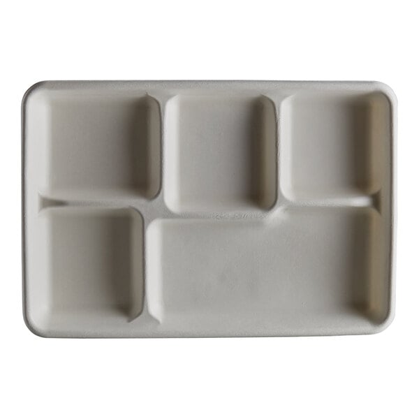 A white tray with five compartments.