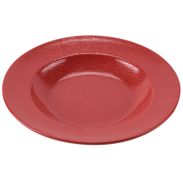 A close-up of a textured red melamine bowl.