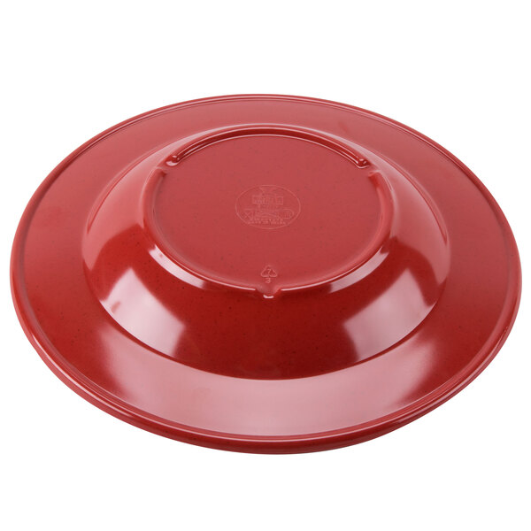 A red bowl with a textured design on a white background.