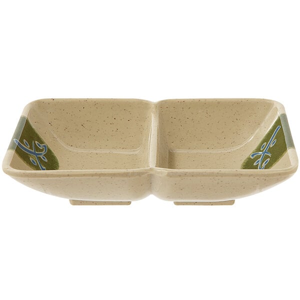 A white GET Japanese Traditional two compartment sauce dish with green and blue designs.