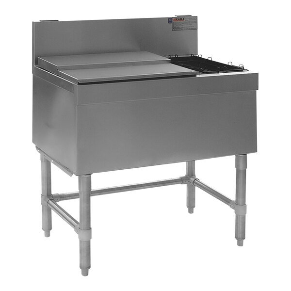 A stainless steel Eagle Group underbar ice chest with a left hand bottle rack on a counter.