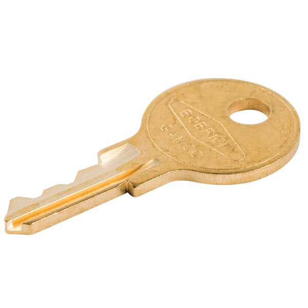 A gold Bobrick cabinet door key.
