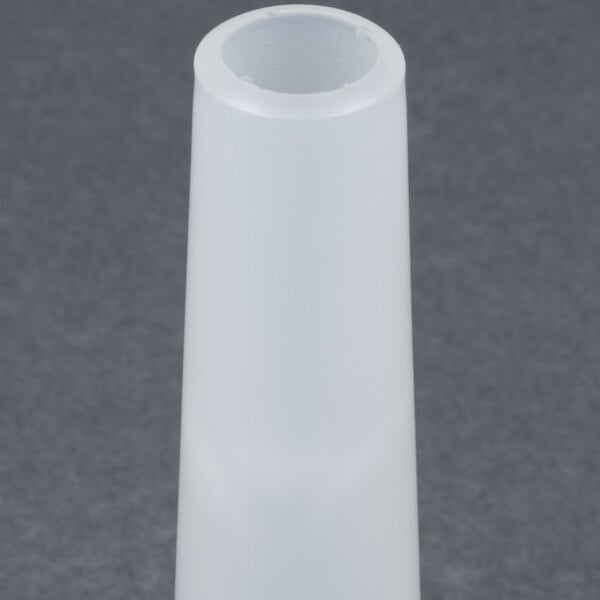 A white plastic cone with a small hole in it.
