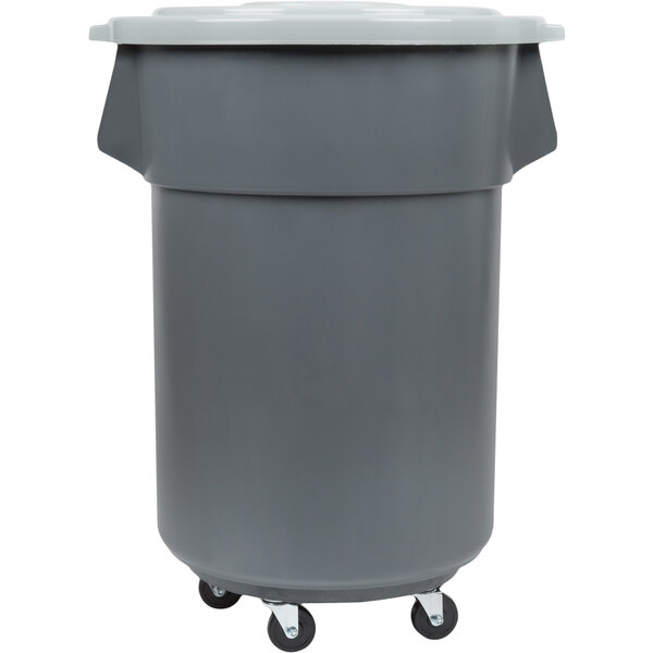 A grey plastic Continental Huskee trash can with wheels.