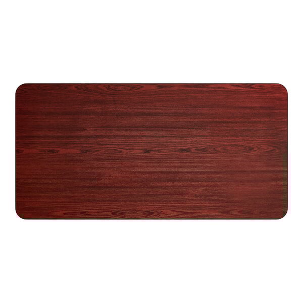 A rectangular laminated table top with a reversible cherry and black finish.