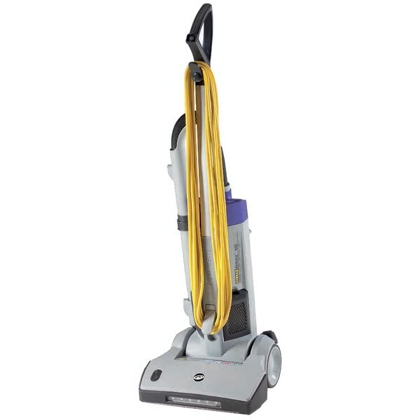 A ProTeam ProGen upright vacuum cleaner with yellow cables and a blue handle.