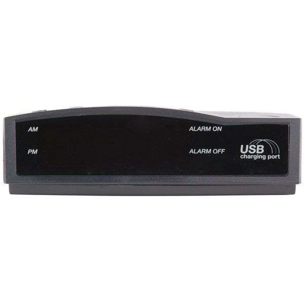 A black electronic Conair alarm clock with a USB port.