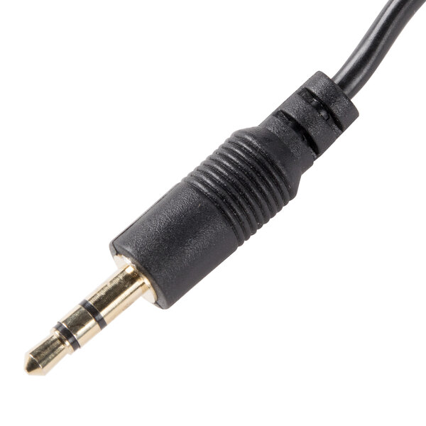 A close up of a black audio cable with a gold connector.