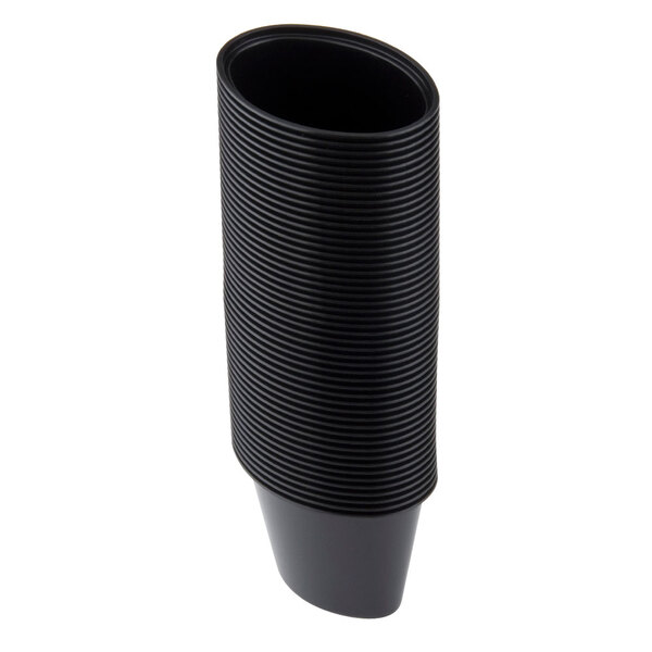 A stack of black oval Newspring plastic souffle cups.