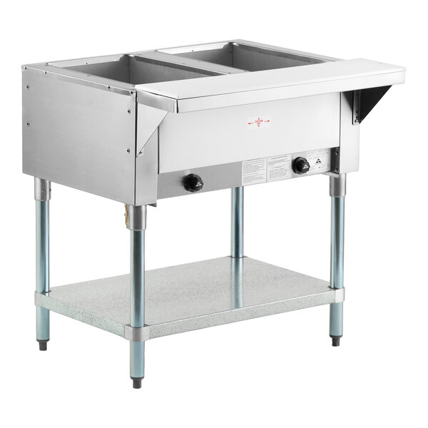A stainless steel two-pan natural gas powered hot food table with an open well and lower shelf.