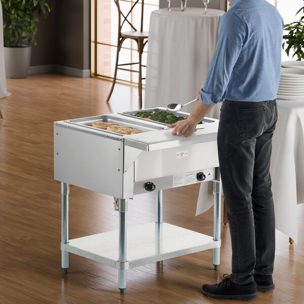 A two-pan natural gas powered hot food table with an open well design.