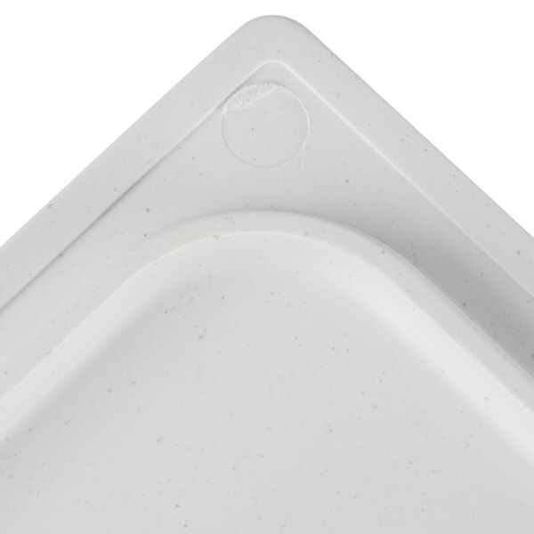 A white square Vollrath Miramar stone resin template with a small hole in the center.