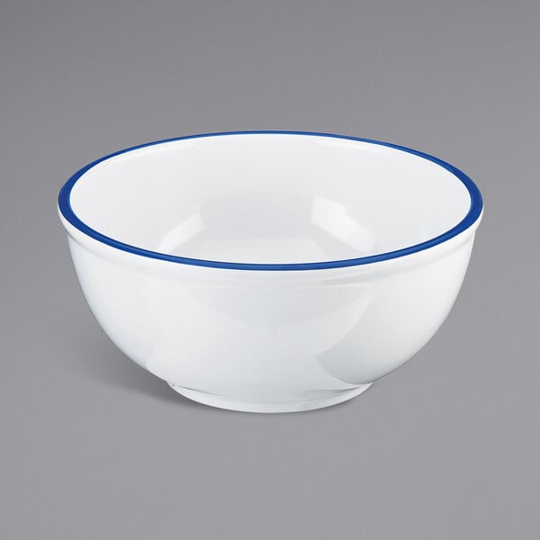 A white melamine bowl with a blue rim.