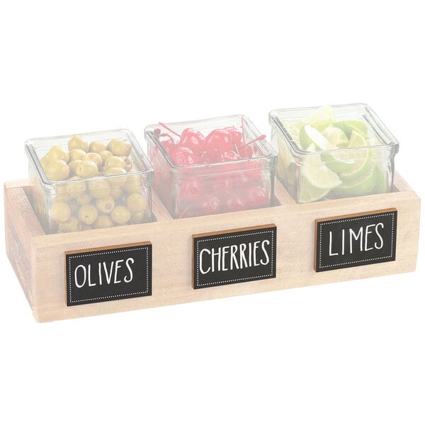 A Cal-Mil chalkboard label on a glass container of cherries.