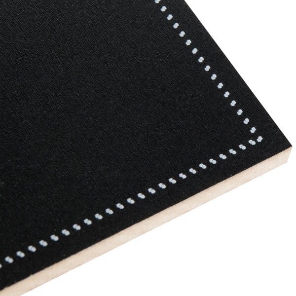 A black chalkboard label with white stitching.