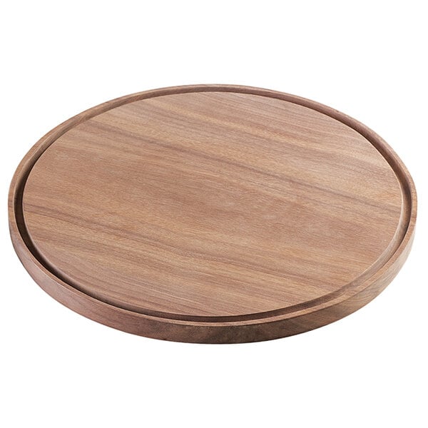 A round walnut serving board with a circular top.