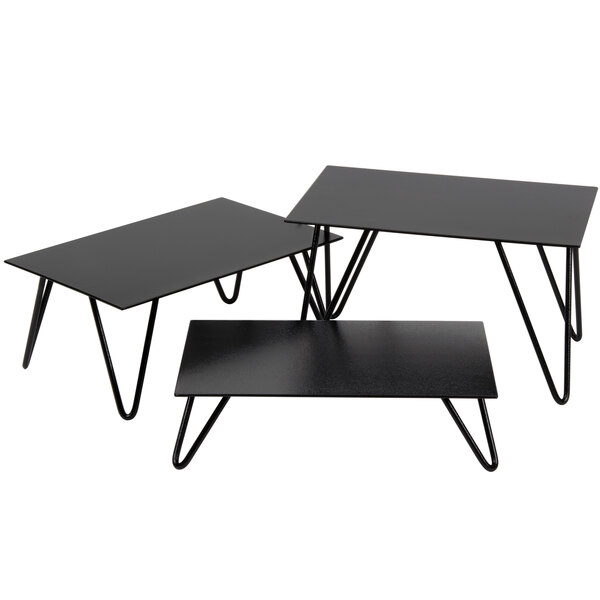 A black rectangular Cal-Mil metal riser set with V-shaped legs.
