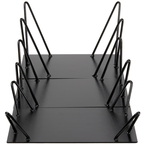 A black rectangular metal riser with black metal legs.