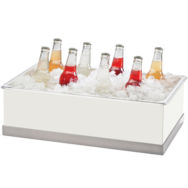 A Cal-Mil clear insert pan with six glass bottles in a cooler.