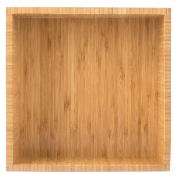 A wooden box with a square top on a wood surface.