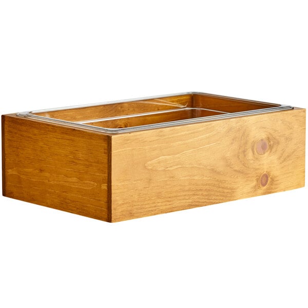 A wooden Cal-Mil ice housing container with a metal liner.