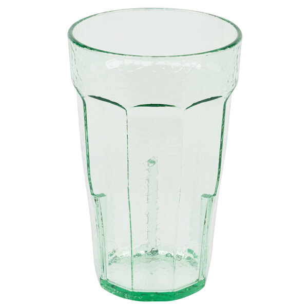 a clear glass with a straw