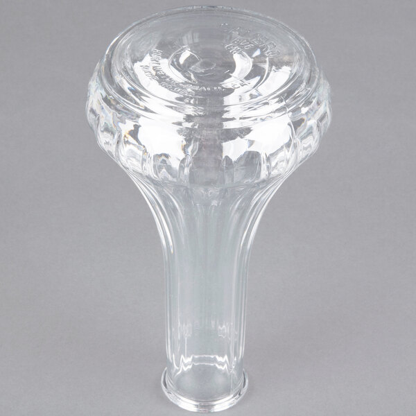 A clear Cambro Camwear bud vase with a circular base on a table.