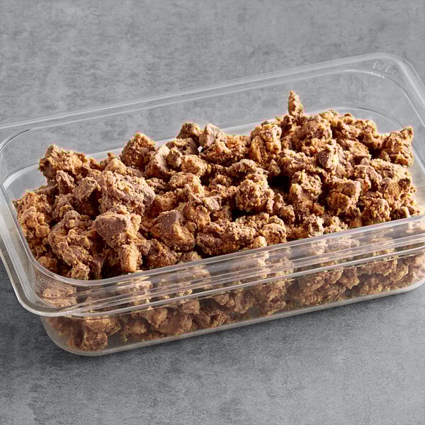 A clear container of REESE'S Peanut Butter Cups Chopped.