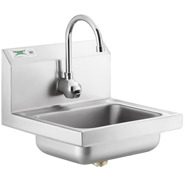 A stainless steel Regency wall mounted hand sink with a T&S automatic faucet.