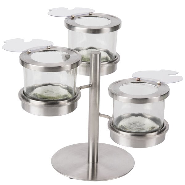 A stainless steel tiered display for three 16 oz. jars with notched lids.