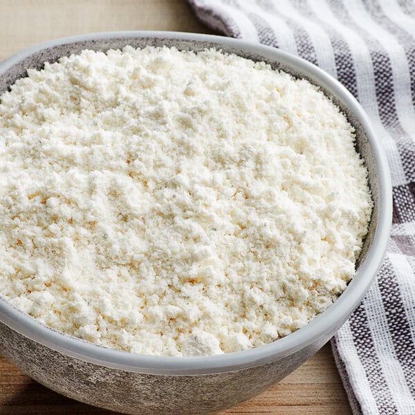 A bowl of white powder on a table.