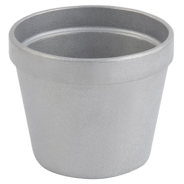 A Bon Chef pewter-glo cast aluminum salad dressing pot with a lid.