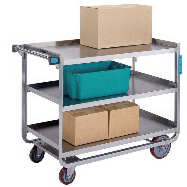 A Lakeside three shelf stainless steel utility cart with boxes on it.