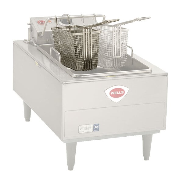 A Wells twin fryer basket on a commercial fryer.