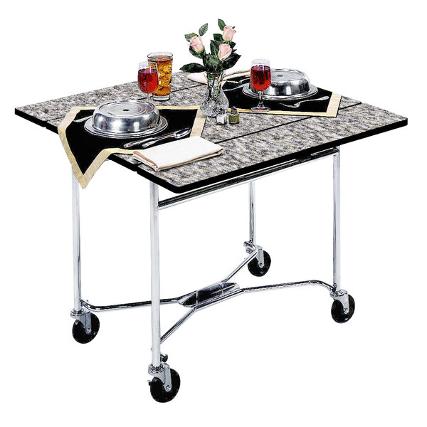 A Lakeside room service table with food and a vase of flowers on it.