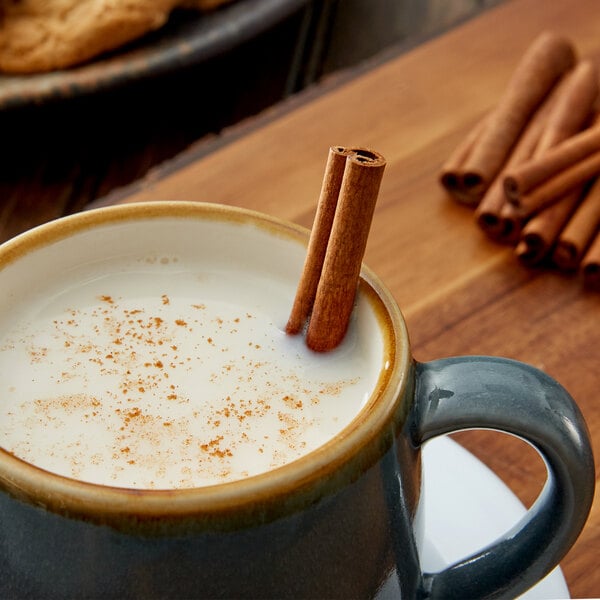 Regal Cinnamon Sticks in a mug of hot coffee.