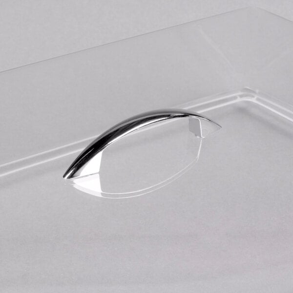 A clear plastic Cal-Mil rectangular tray cover with a handle.