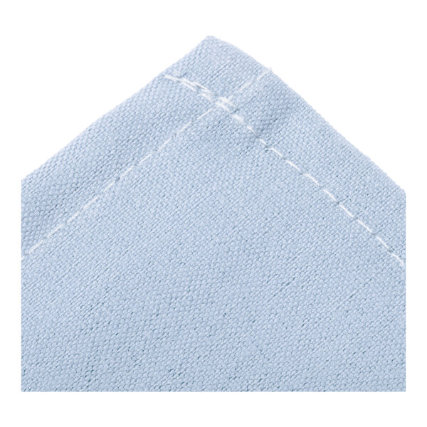 A light blue rectangular cloth with white stitching.