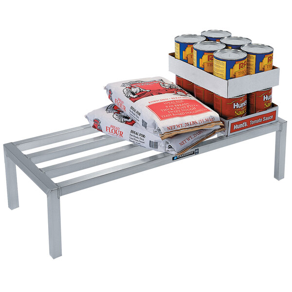 A Lakeside aluminum dunnage rack with food and cans on it.