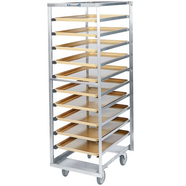 A Lakeside stainless steel sheet pan rack with trays on wheels.