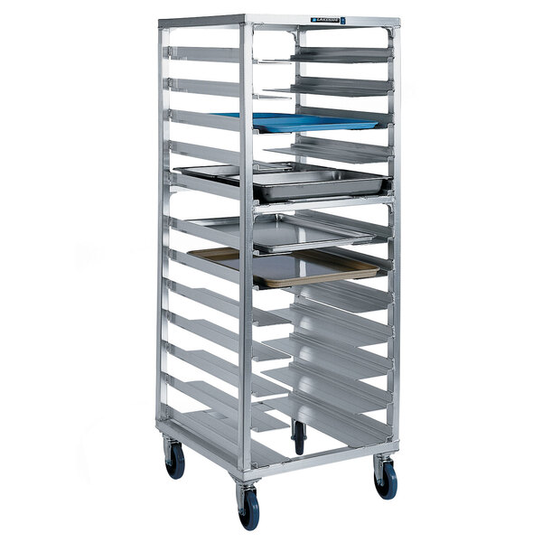 A Lakeside metal sheet pan rack with trays on wheels.