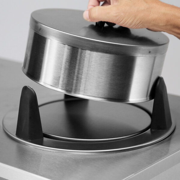 A stainless steel heated plate dispenser with an enclosed design for holding and dispensing plates sized 10 1/4 to 11 inches.