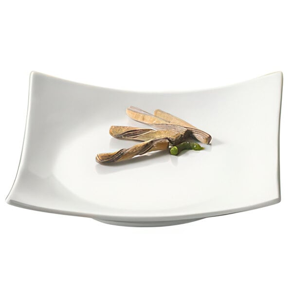 A white square CAC porcelain plate with sushi on it.