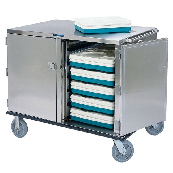 A Lakeside stainless steel tray cart filled with trays on wheels.