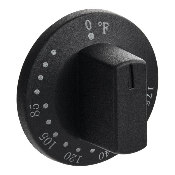 A black thermostat knob with temperature markings in degrees Fahrenheit.