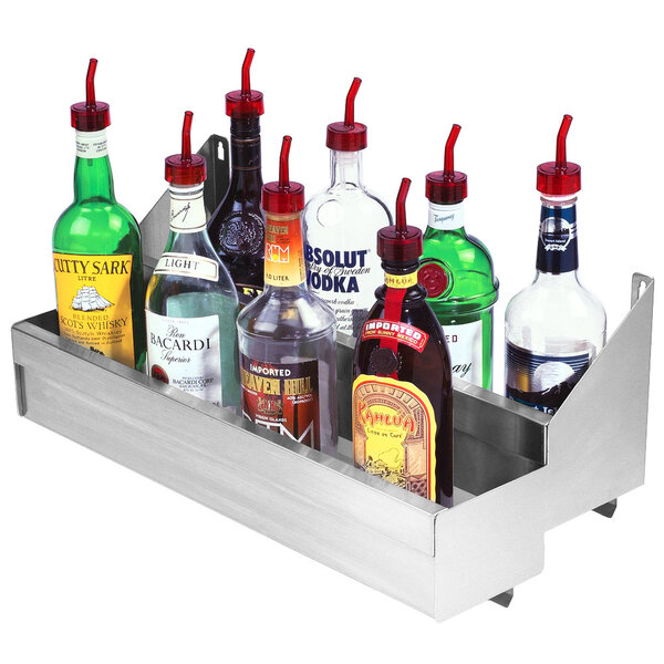 A stainless steel Advance Tabco double tier speed rail holding bottles of alcohol.