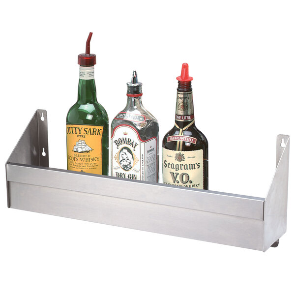 A metal shelf holding a bottle of liquor.