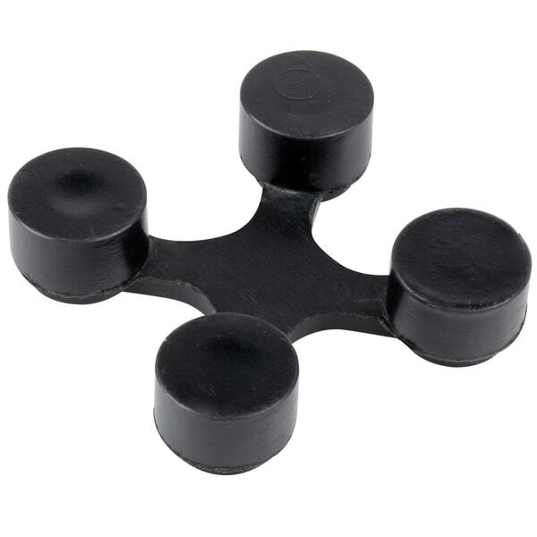 A black plastic connector with four circles.